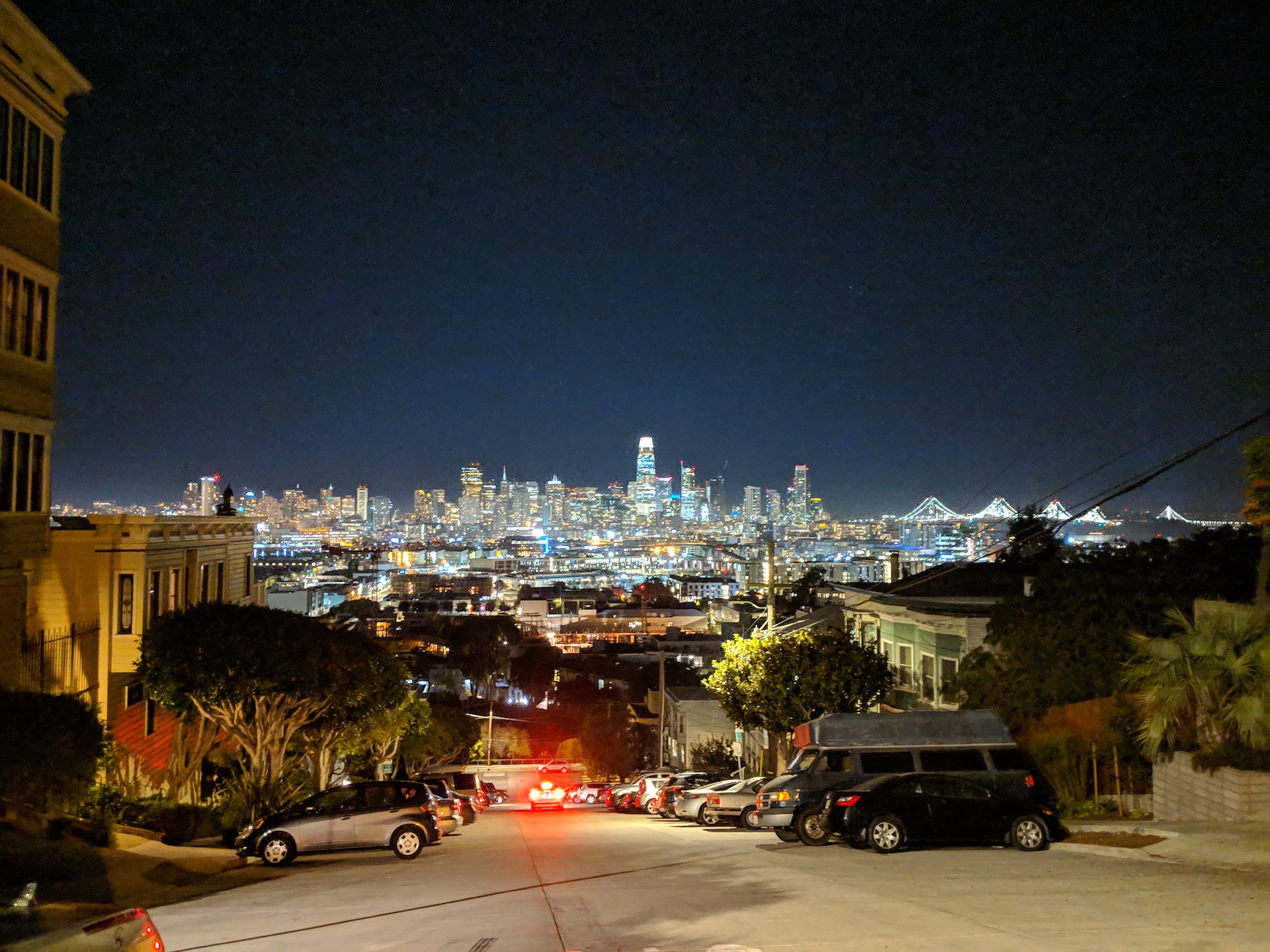 Cars parked on Portero Hill with downtown SF in
background